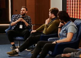 image of individuals discussing while sitting