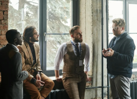image of individuals discussing while standing